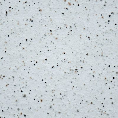 Close-up of white engineered quartz with fine speckles
